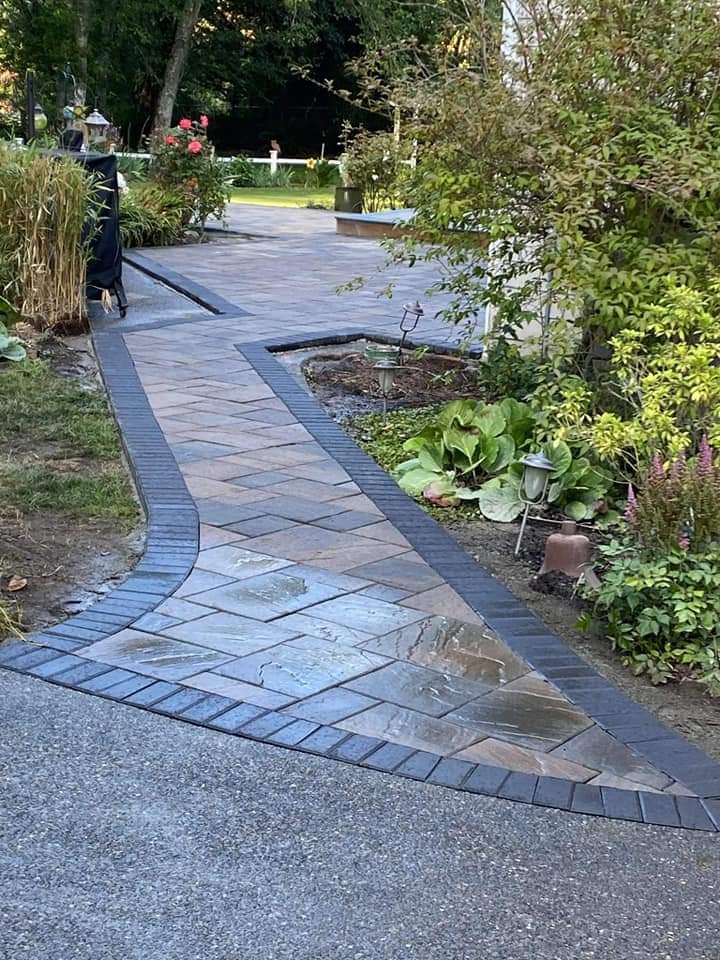 Paver walkway with path lighting and planted borders