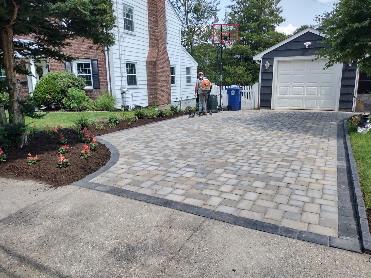 New mulch beds and plantings finished at the end of a visit